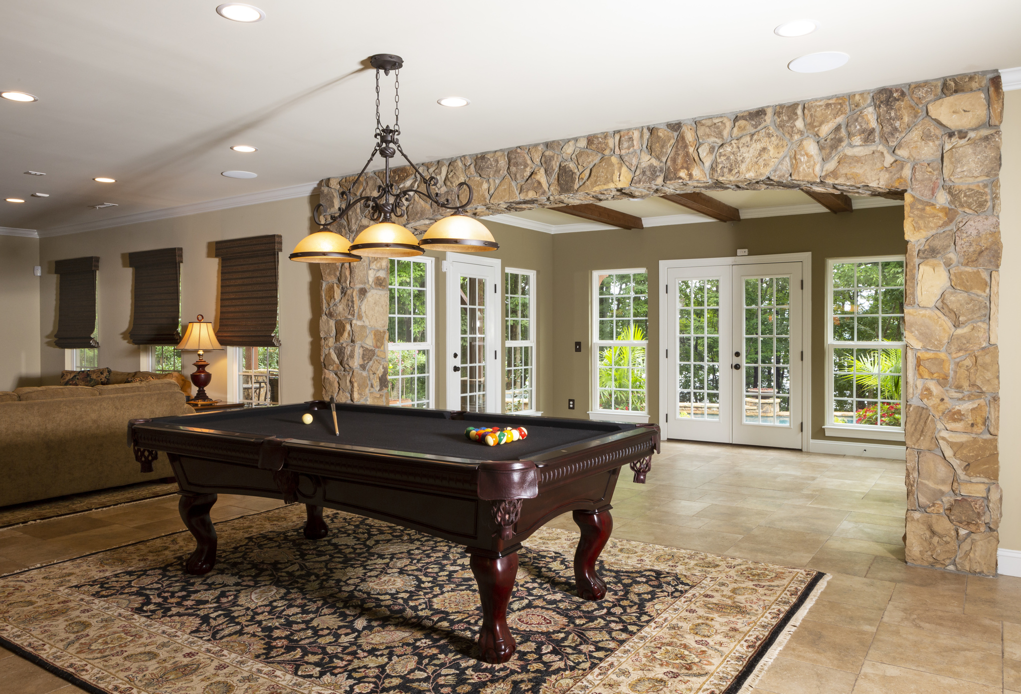 game room with pool table custom lighht fixture