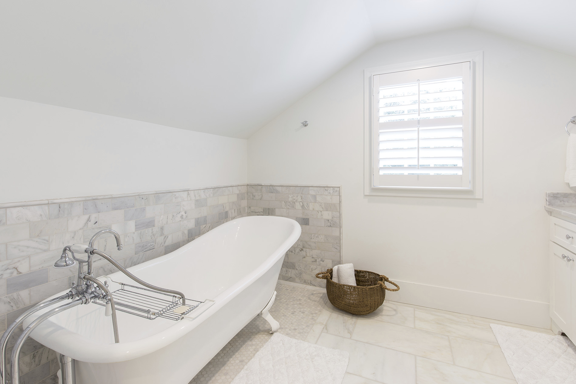 Custom all white bathroom with geometric tile detail