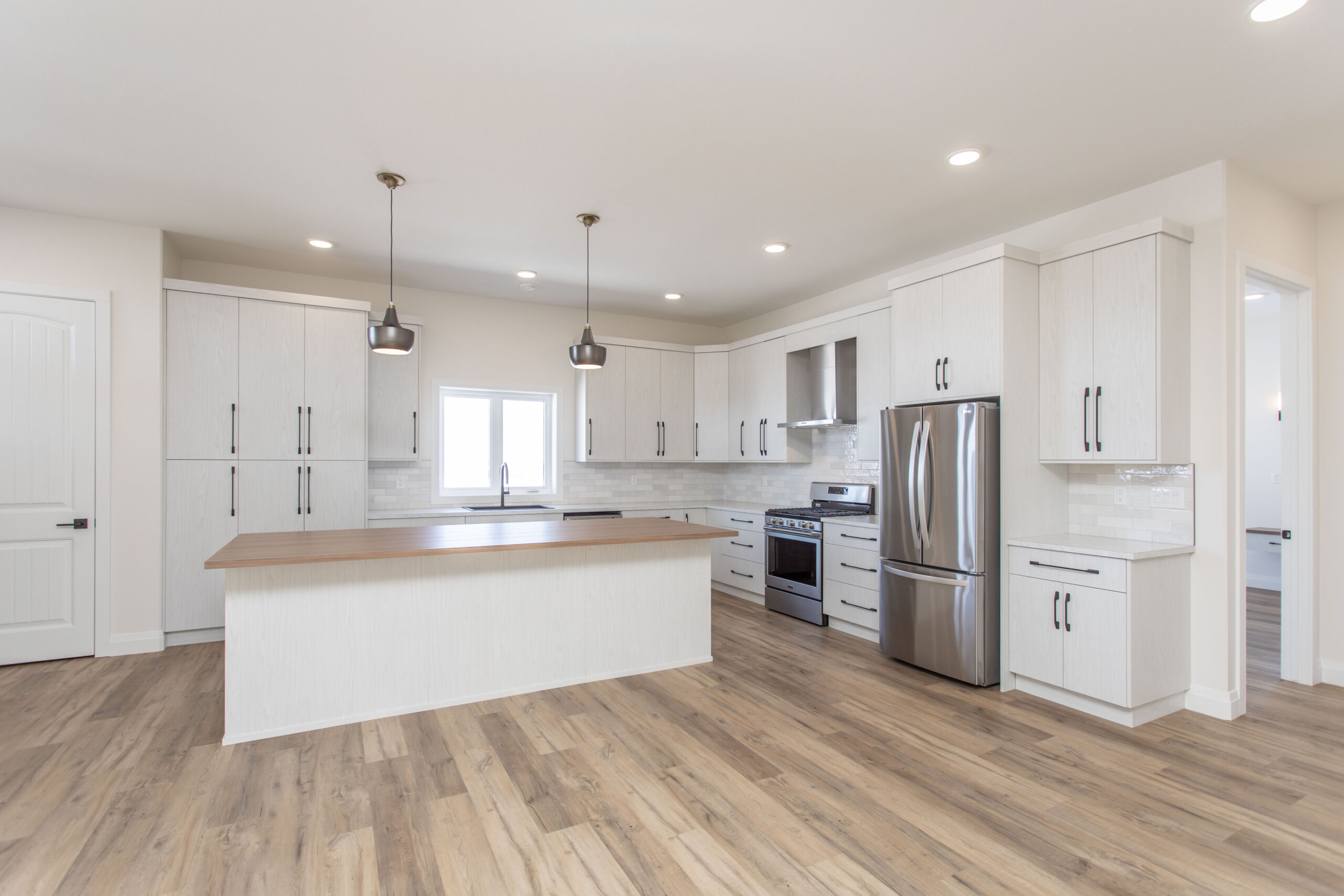 white and wood kitchen in barndominum build in Central Alberta