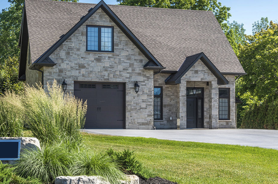 exterior of luxury custom home grey bruce with turfgrasss front lawn