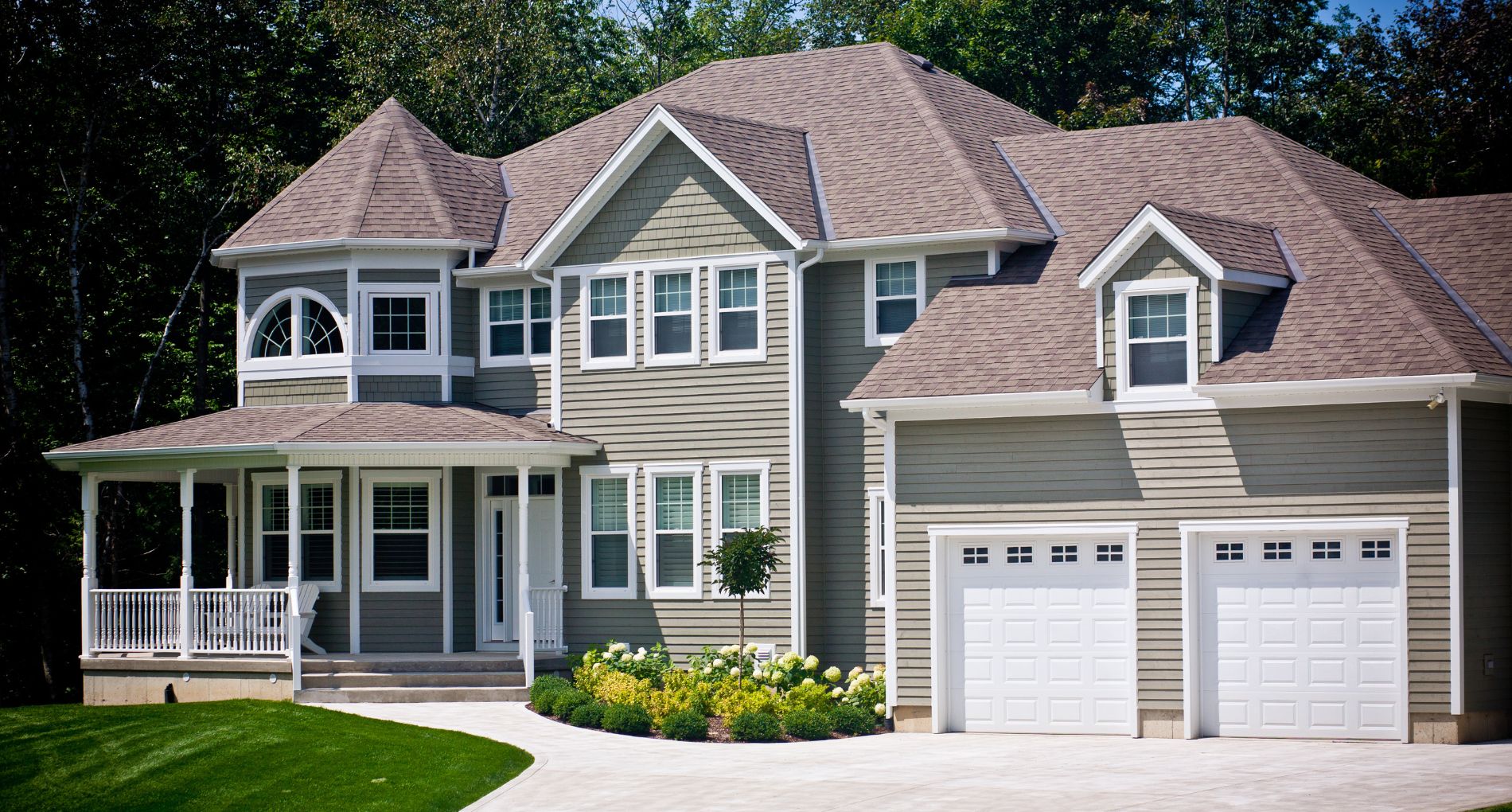 Elegant Custom Home Exterior with Wraparound Porch