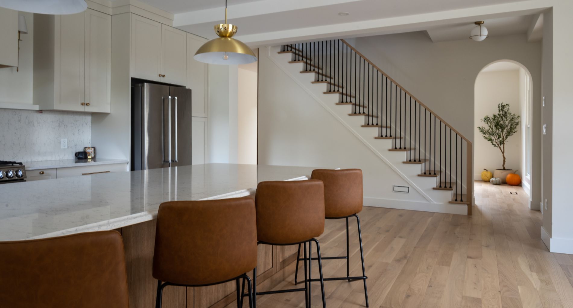 Curved Ceiling Cottage with Olive Tree and Earthy Design Details