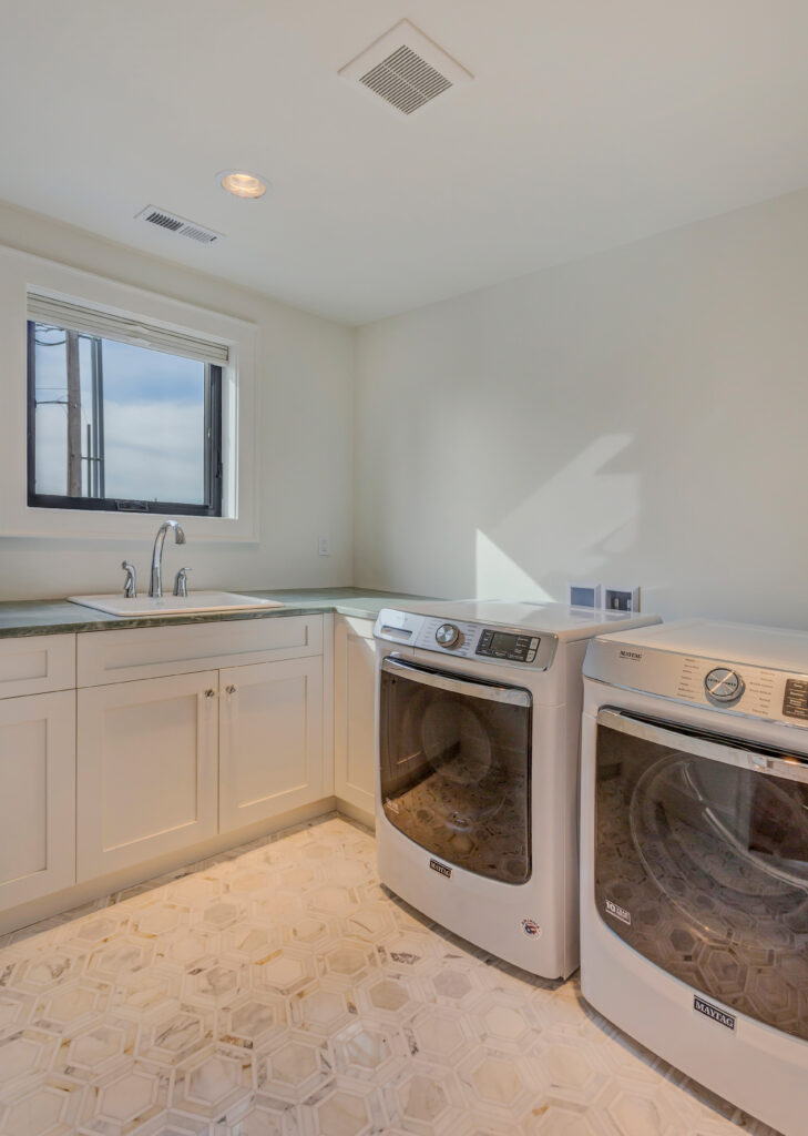 a nice laundry room design idea is to have a window, to make sure you can air the space when necessary | Alair Homes Kirkland 