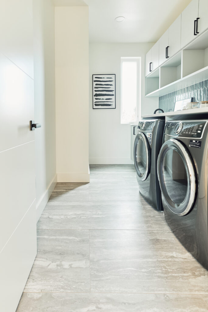 Another great laundry room design idea we implemented in a custom home on Lake Washington is we planned for Storage Solutions Wisely | Alair Homes Kirkland