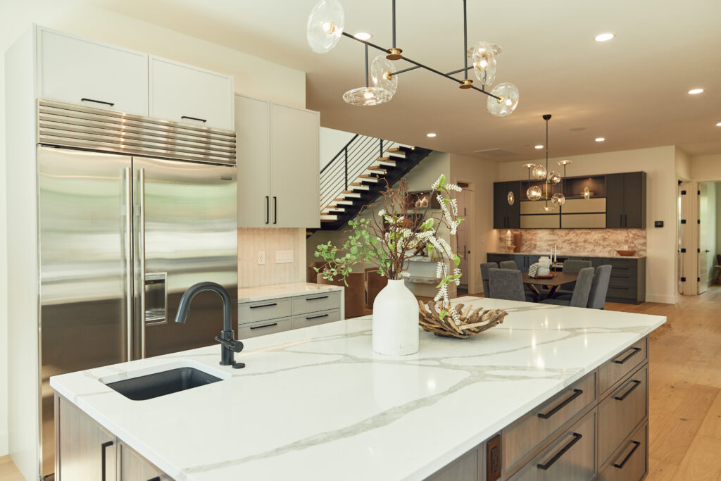 a photo of a custom kitchen with a dry bar design in the background 
