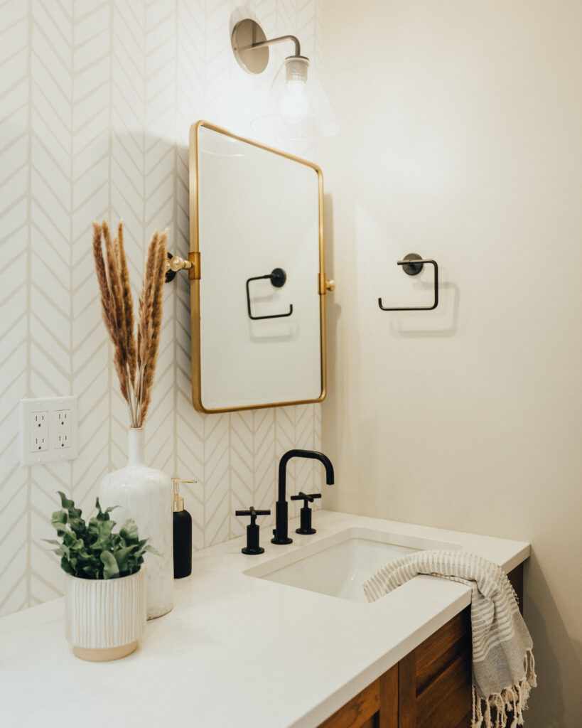 Clear and Classic Empire Sconce in a custom bathroom by Alair Homes Kirkland 