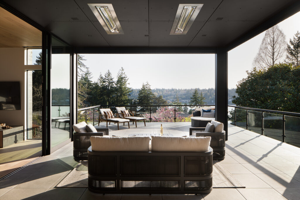 a beautiful terrace as a great example of indoor outdoor living space in a custom home on lake Washington