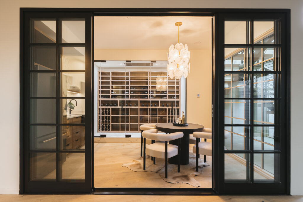 a unique light fixture is a great wine room design idea for your Shoreline WA custom home 