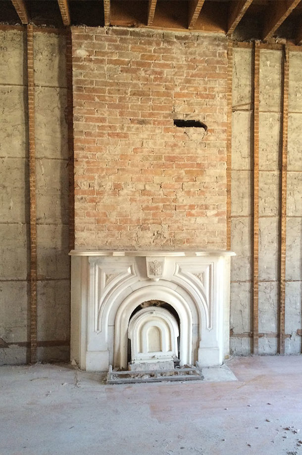 Salvaged marble and brick fireplace found in teardown renovation