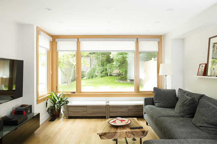 living area with large windows overlooking turf lawn