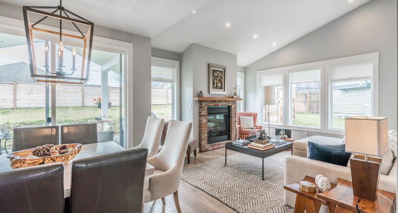 Light wall with will window and brick fireplace