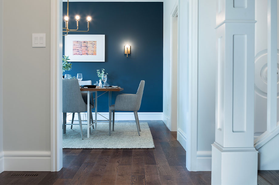 hallway view into dining area painted navy with white trim