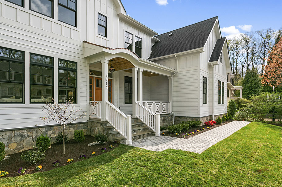 exterior of single story custom home with idyllic turfgrass front lawn