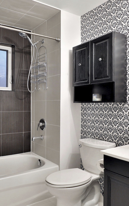 custom bathroom with black and white patterned wallpaper