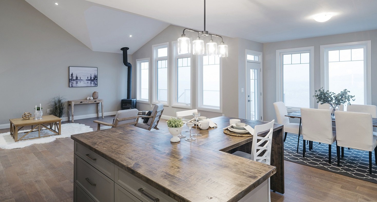 modern all white interior with wood finishings and countertop and a-frame stacked windows