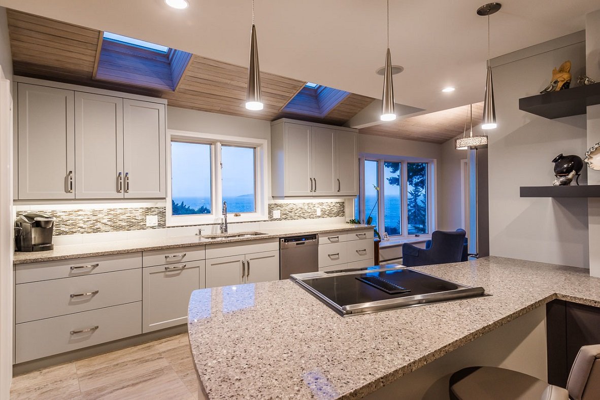 modern monochromatic cream kitchen with inset skylights