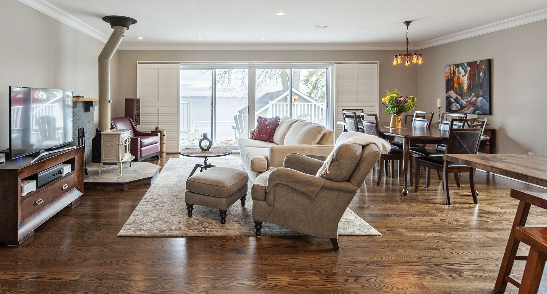 custom living area with industrial style fireplace and cushy sofas facing tv