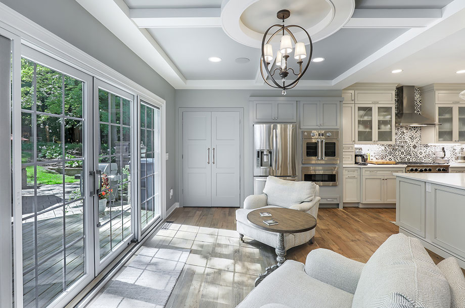 custom kitchen with sitting area facing outdoor garden letting in natural light