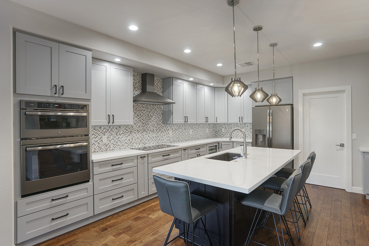 Custom Chandler Kitchen with Off-White Cabinets and geometric backsplash