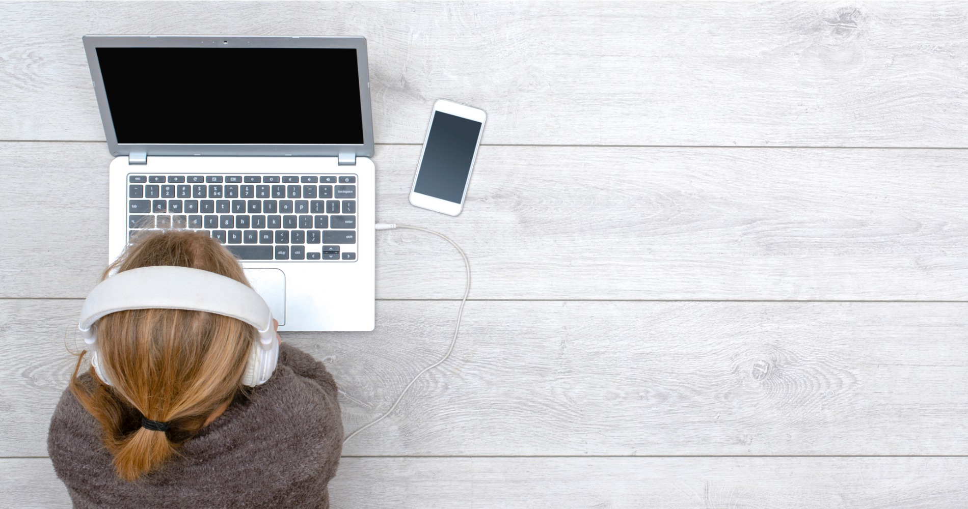 Child using her laptop to do work