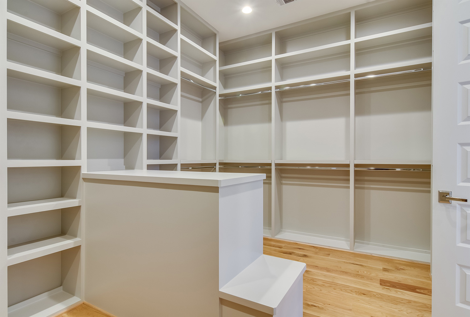walk in closet with built in floor to ceiling shelving