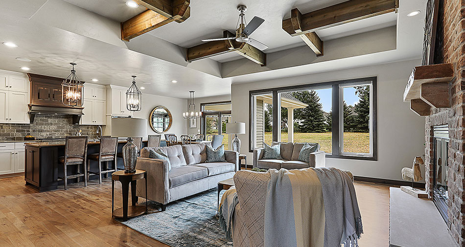 Living area with neutral decor and large windows