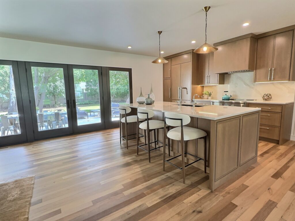 After photo of modern kitchen renovation with pendant lighting