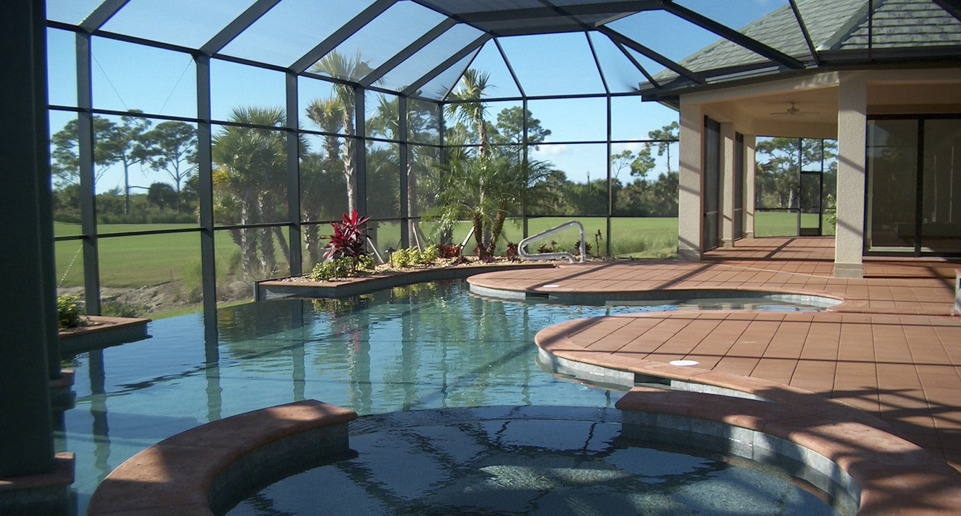 Large glass pool house addition for custom home in Bonita Springs